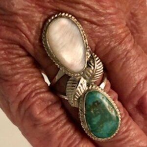 One turquoise and mother of pearl ring embedded in silver size 7 Unique
